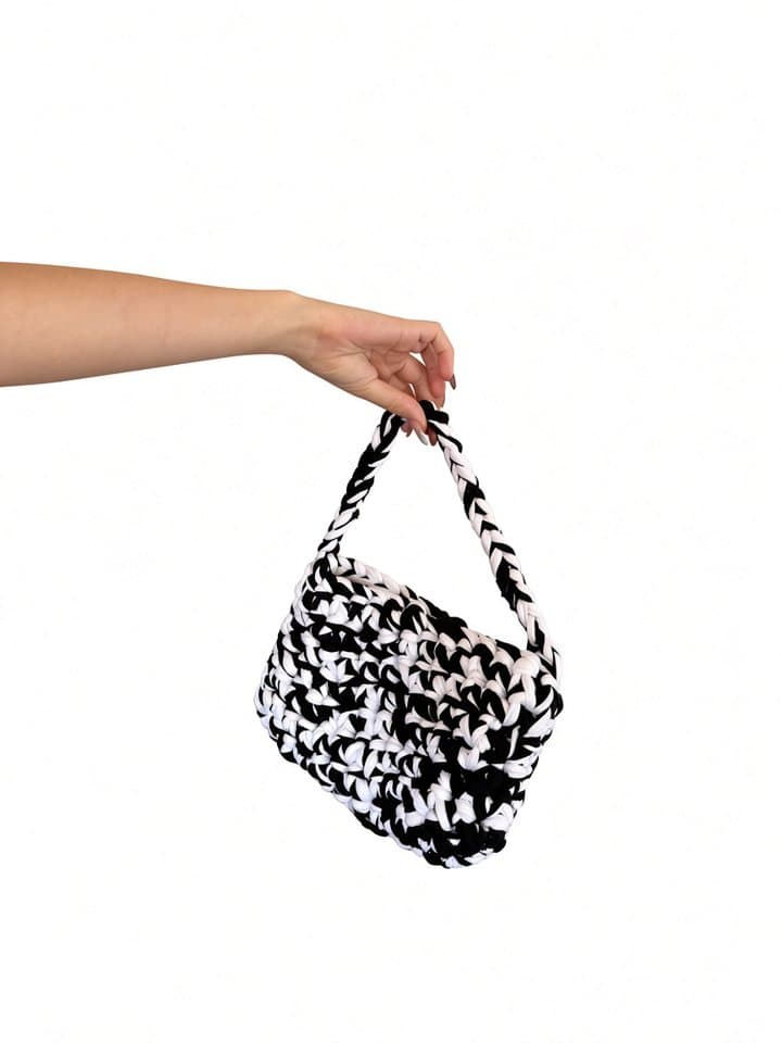 The Sienna bag held in hand